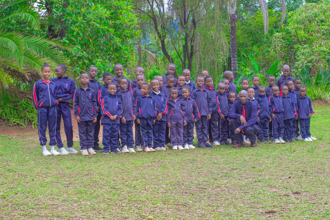 Primary school learners standing together outdoors