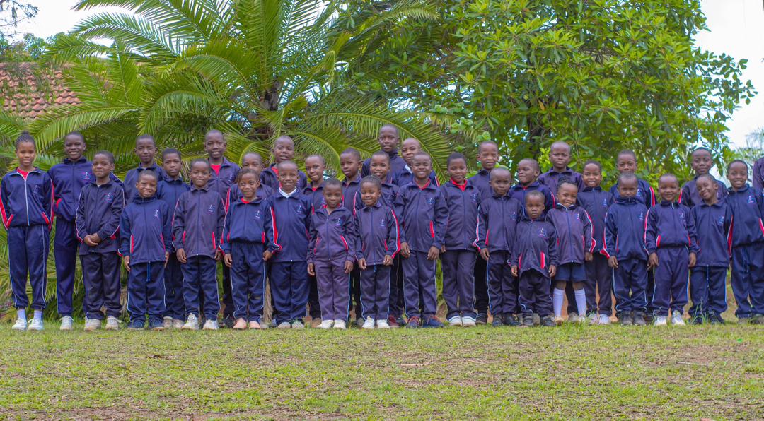 Learners gathered together for a wide school group photograph