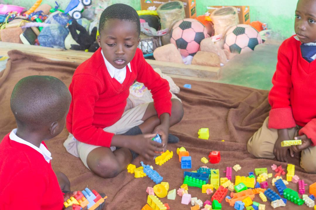 Young learners exploring colourful building blocks together